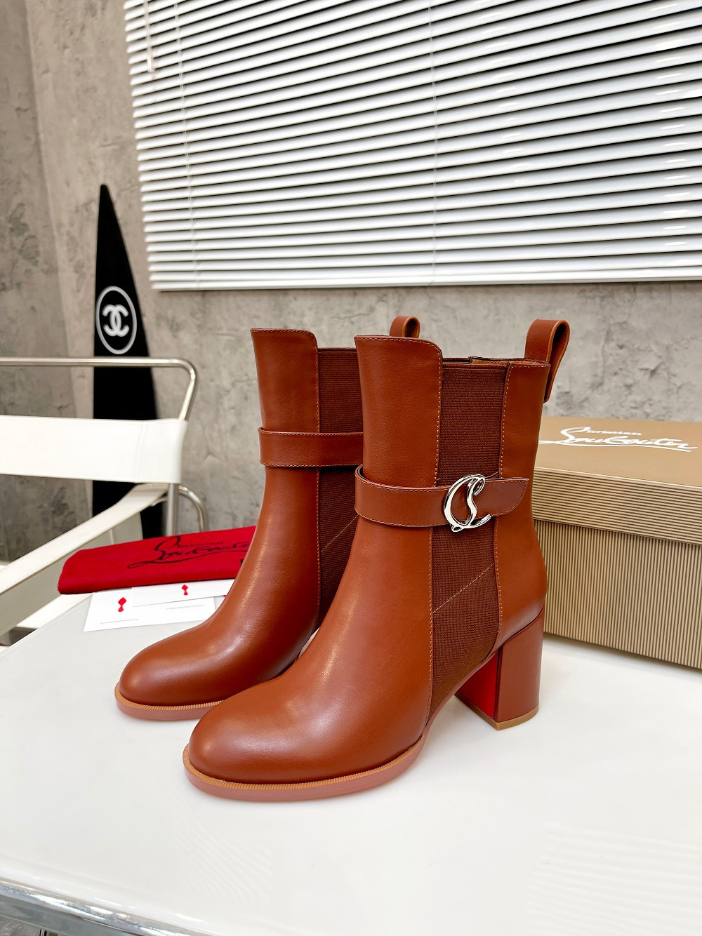 UA Ch**an Louboutin (CL) launched a new collection of chunky heeled platform boots