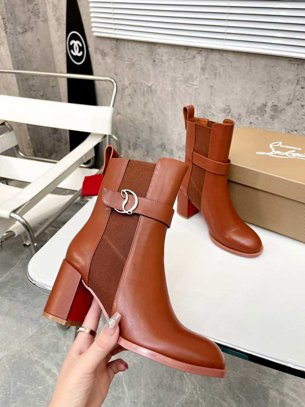 UA Ch**an Louboutin (CL) launched a new collection of chunky heeled platform boots