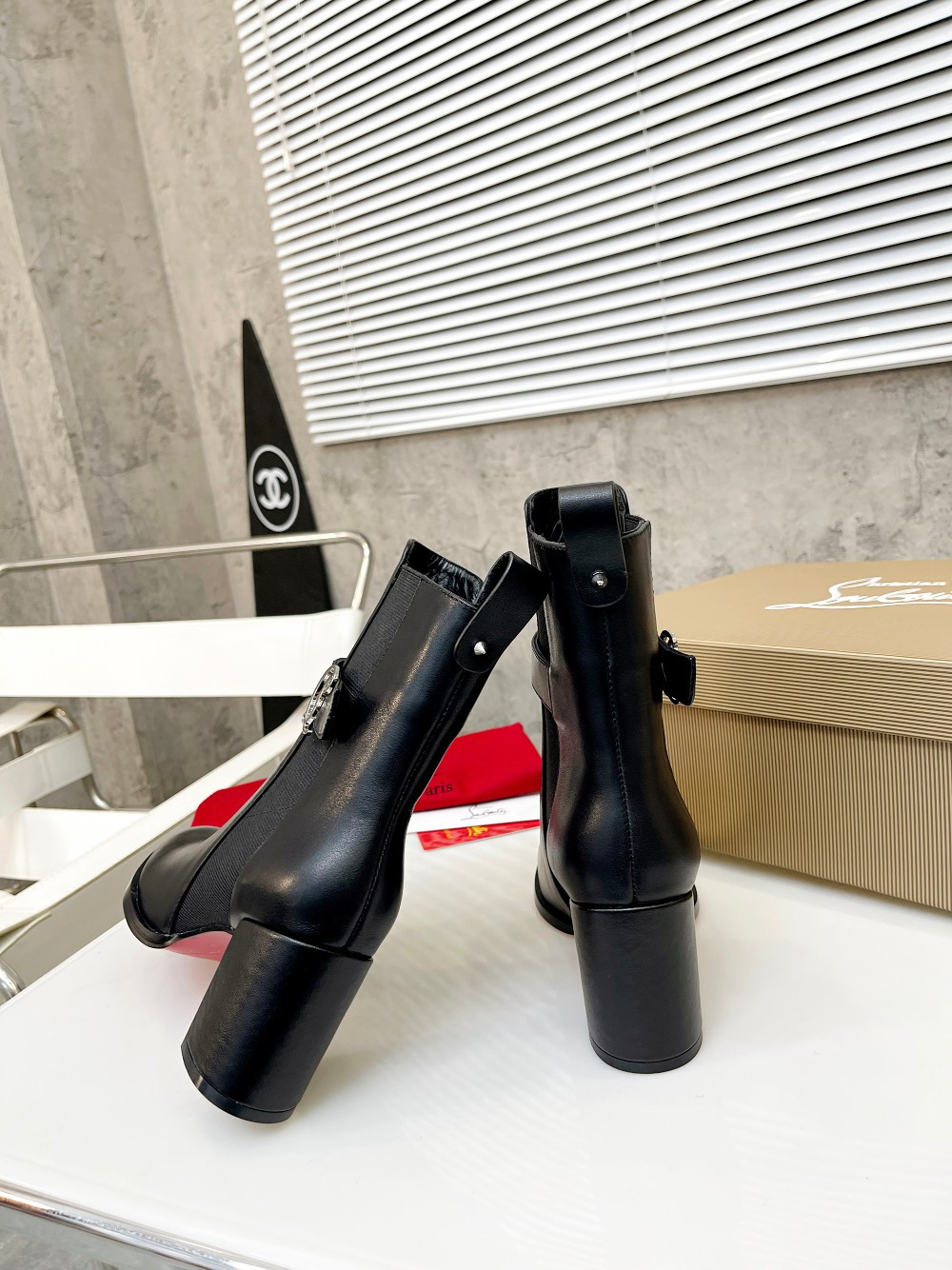 UA Ch**an Louboutin (CL) launched a new collection of chunky heeled platform boots